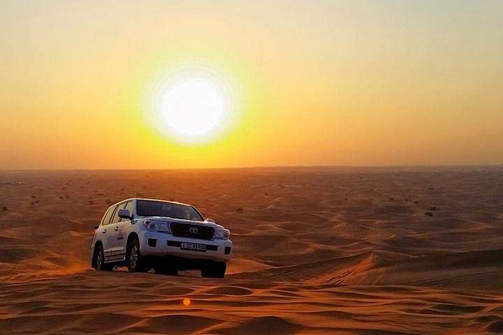 Experience the magic of a desert sunrise as you navigate stunning sand dunes in a 4x4. Capture unforgettable moments against a backdrop of golden sands and a rising sun.